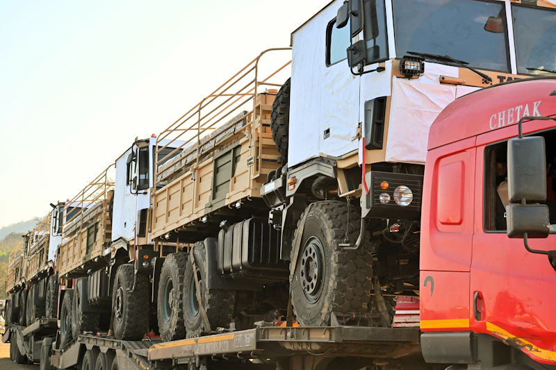A row of parked commercial trucks