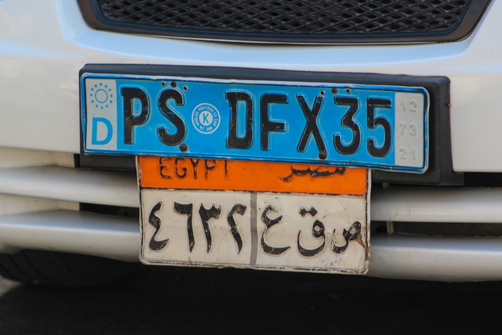 a close up of a license plate on a car