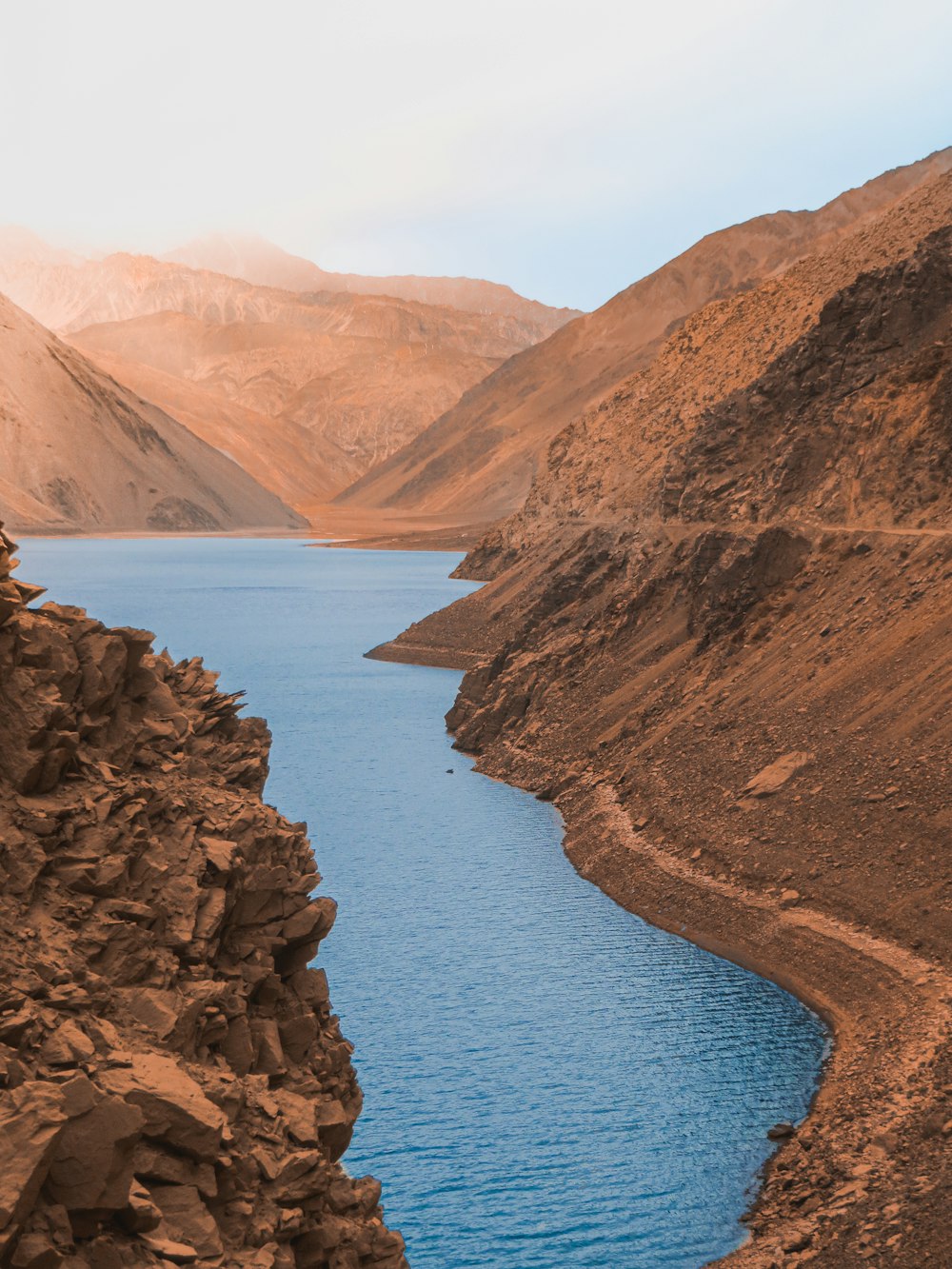 a large body of water surrounded by mountains