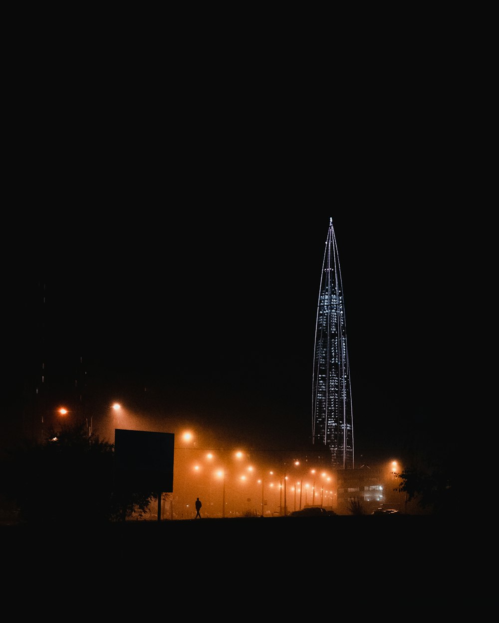 a very tall tower lit up at night