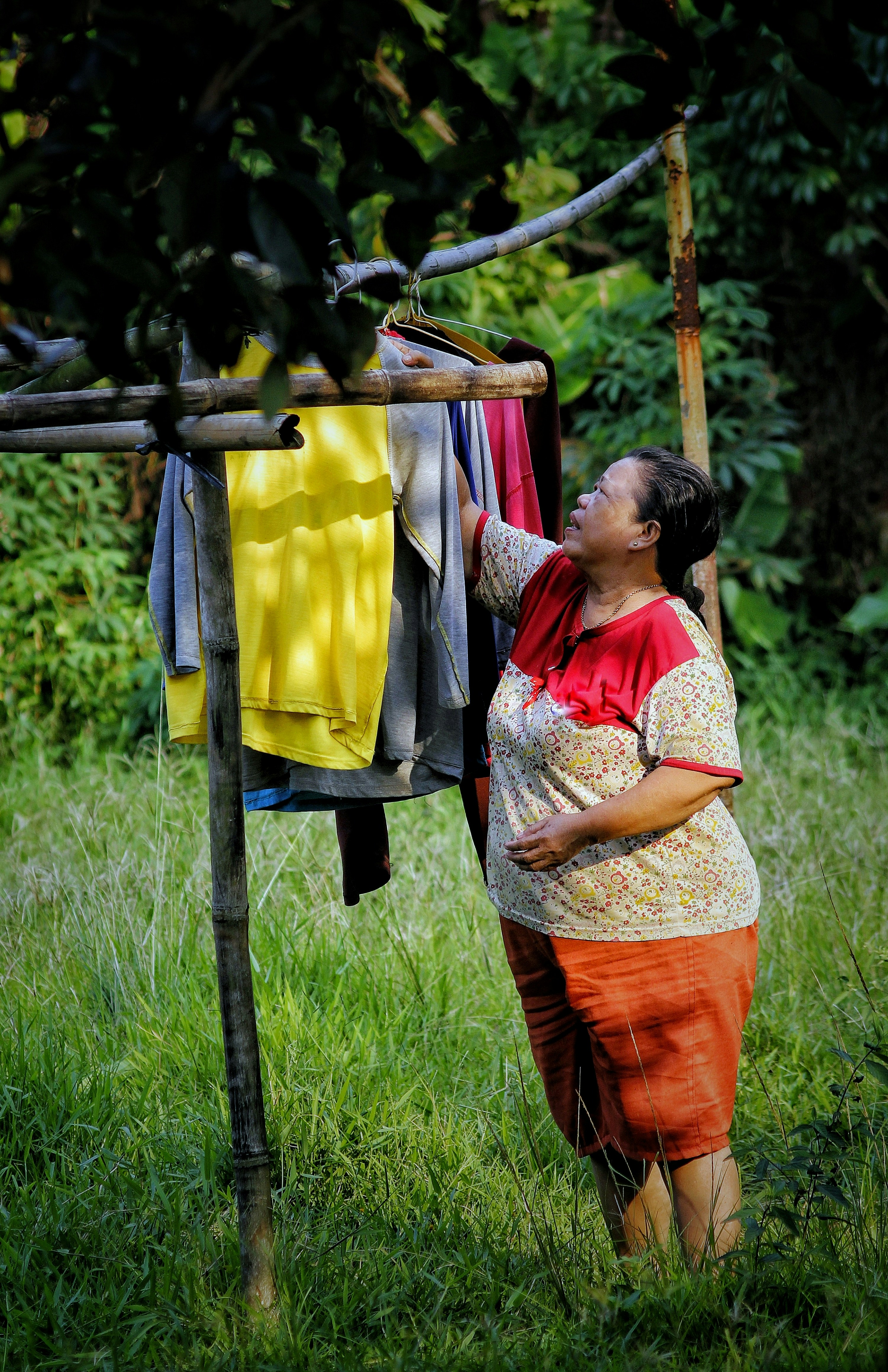 A mother is drying clothes.