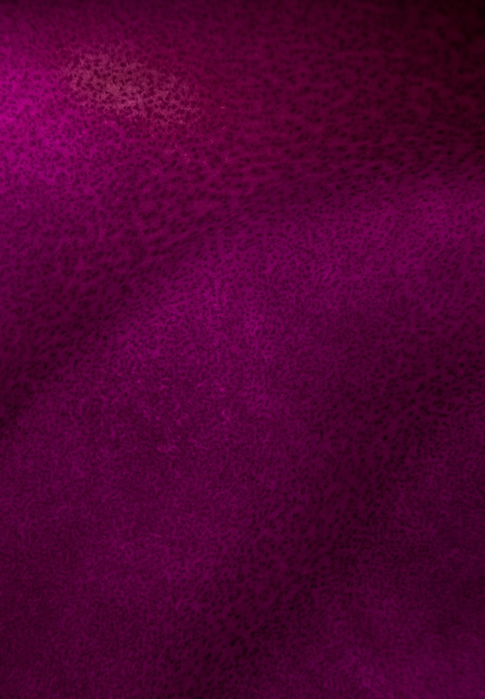 a dark purple background with a pattern of small dots