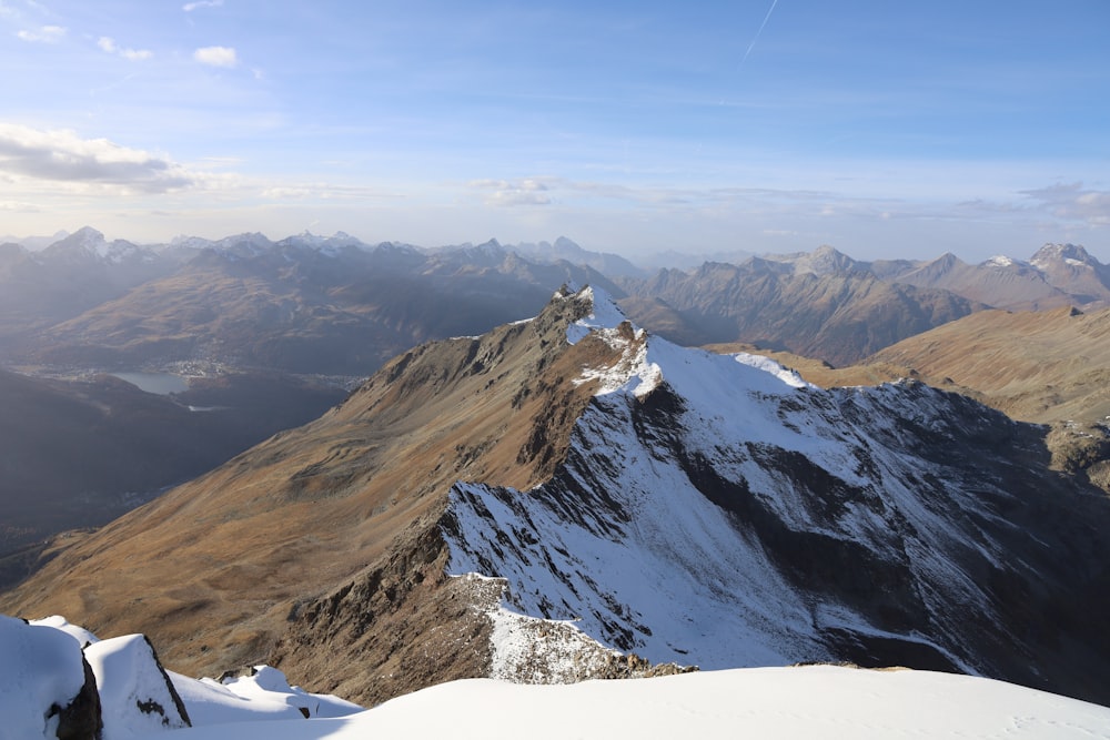 a view from the top of a snowy mountain