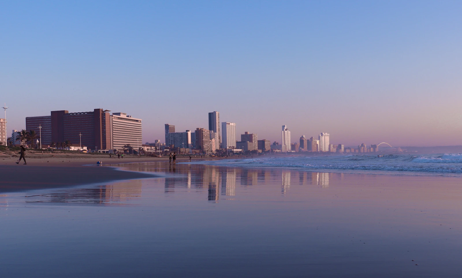 A beach with a city in the backgro