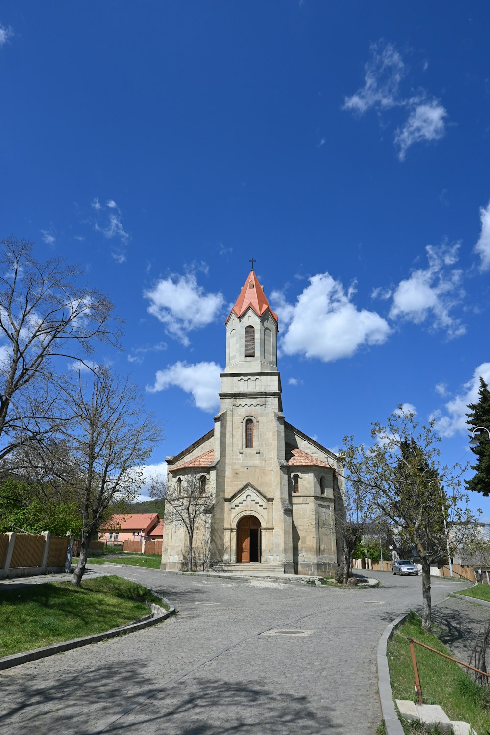 a church with a clock tower on a sunny day