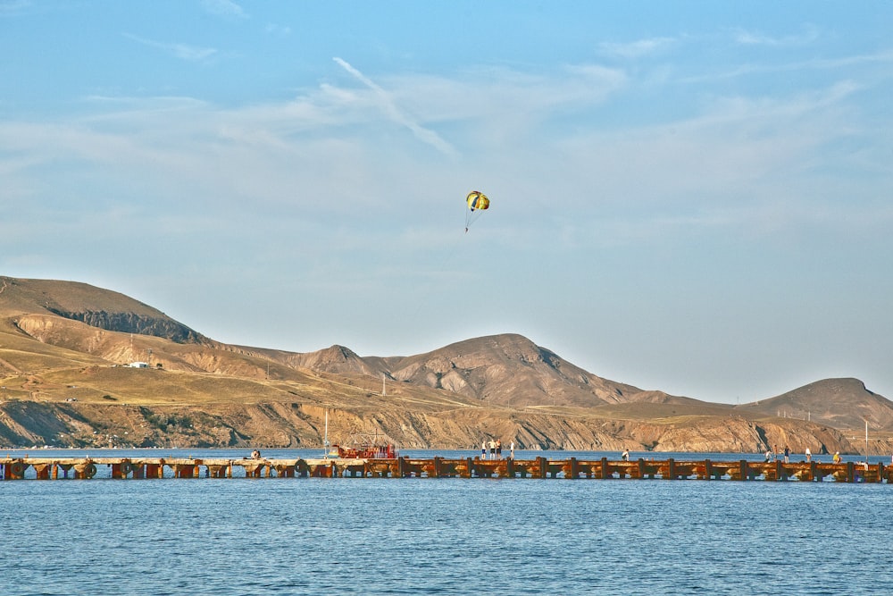 a large body of water with mountains in the background