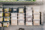 a shelf filled with containers and containers of food