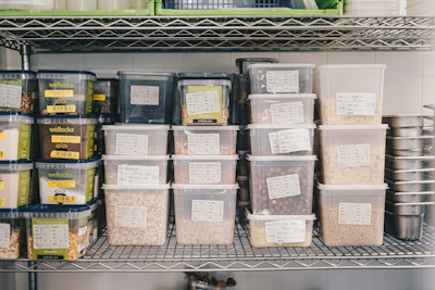 Neatly arranged shelves filled with packaged grains, beans, and spices.