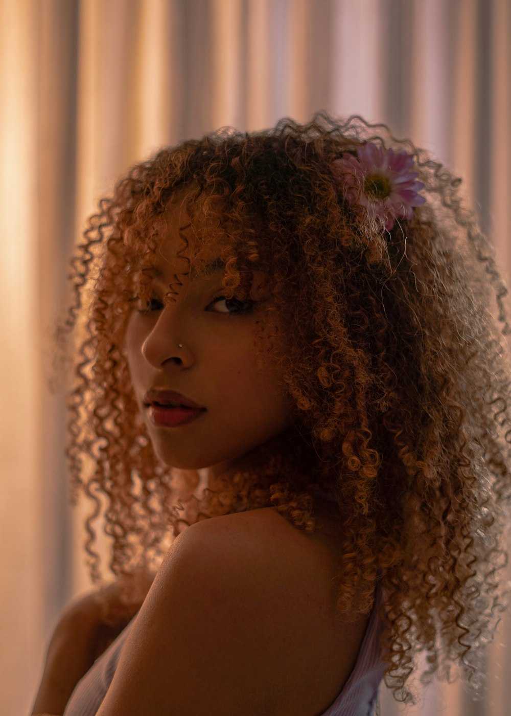 a woman with a flower in her hair