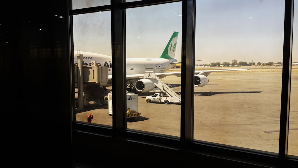 a large jetliner sitting on top of an airport tarmac