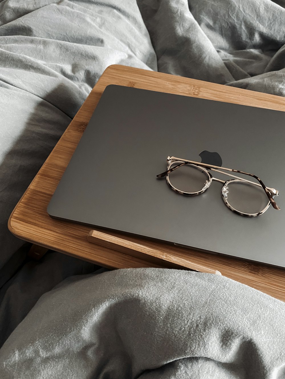 a laptop with a pair of glasses on top of it