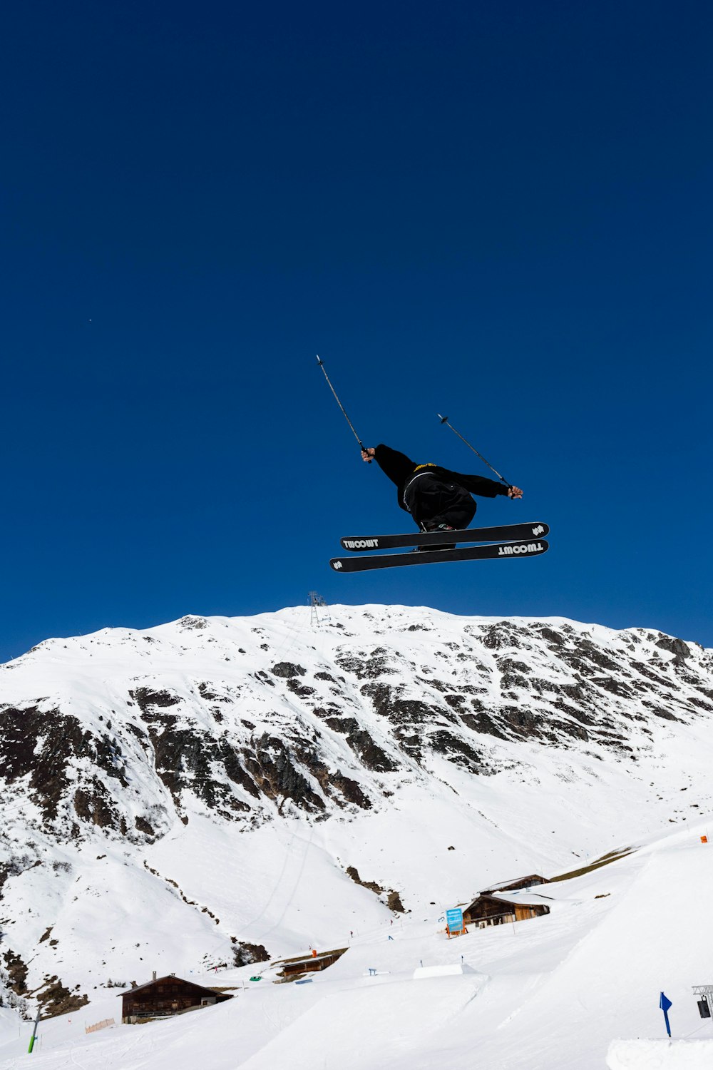 a man flying through the air while riding skis