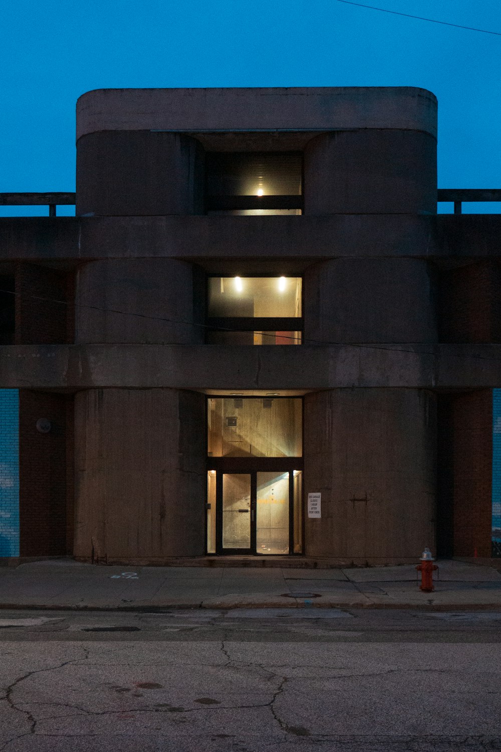 a building with a fire hydrant in front of it