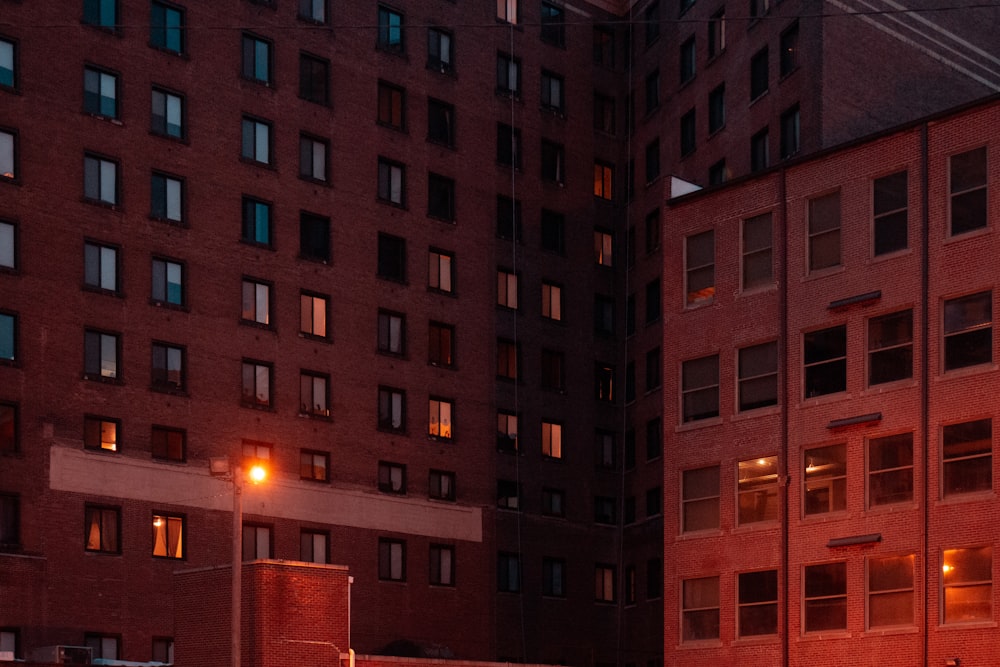 a red brick building with a street light in front of it