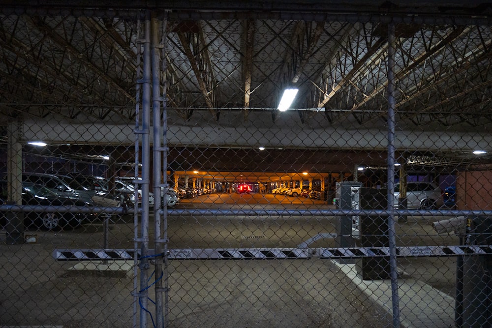 a parking garage with a chain link fence