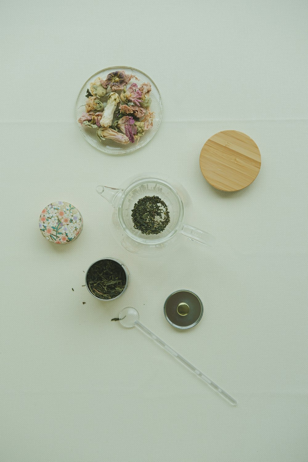 a white table topped with bowls of food