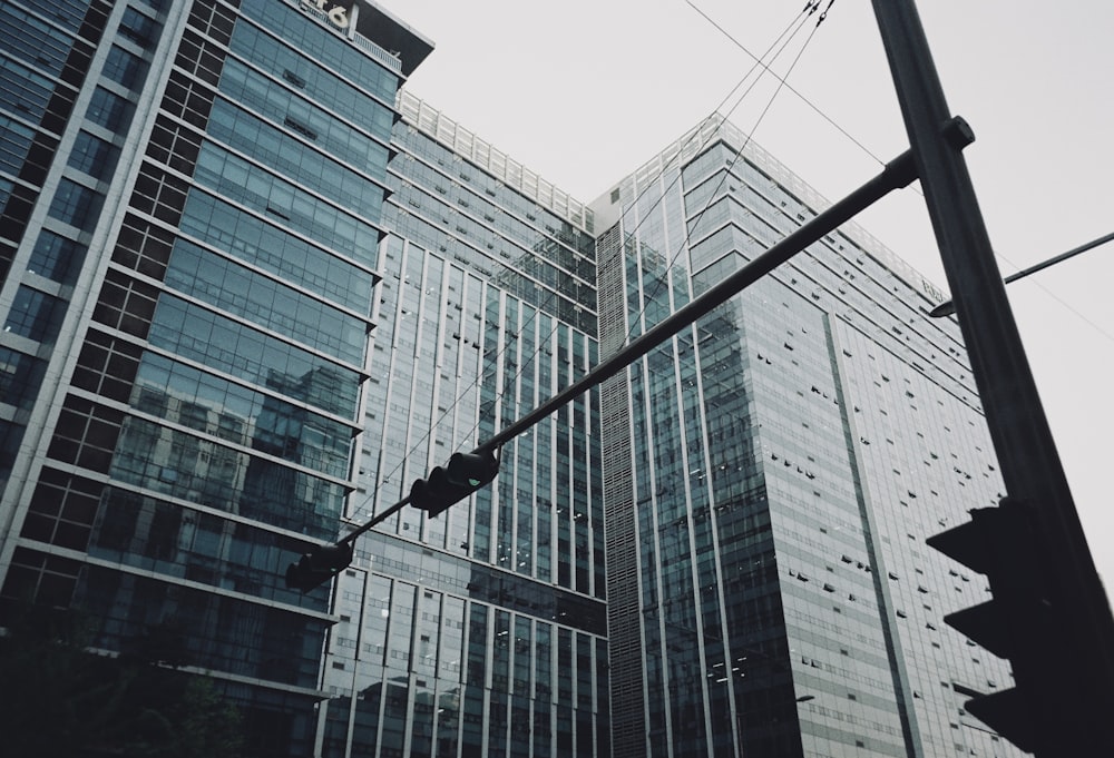 a traffic light sitting in front of tall buildings