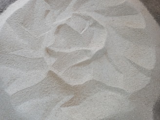 A close-up of a flower of life pattern on a textured surface.