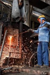 a man working on a piece of metal