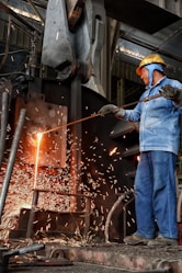 a man working on a piece of metal