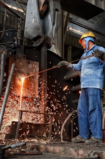 a man working on a piece of metal