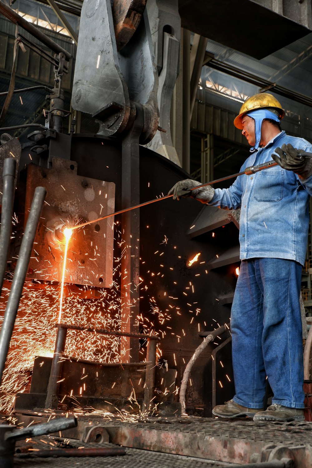 a man working on a piece of metal