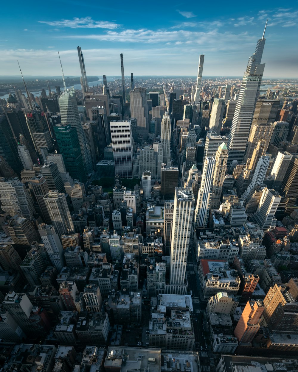 an aerial view of a city with tall buildings