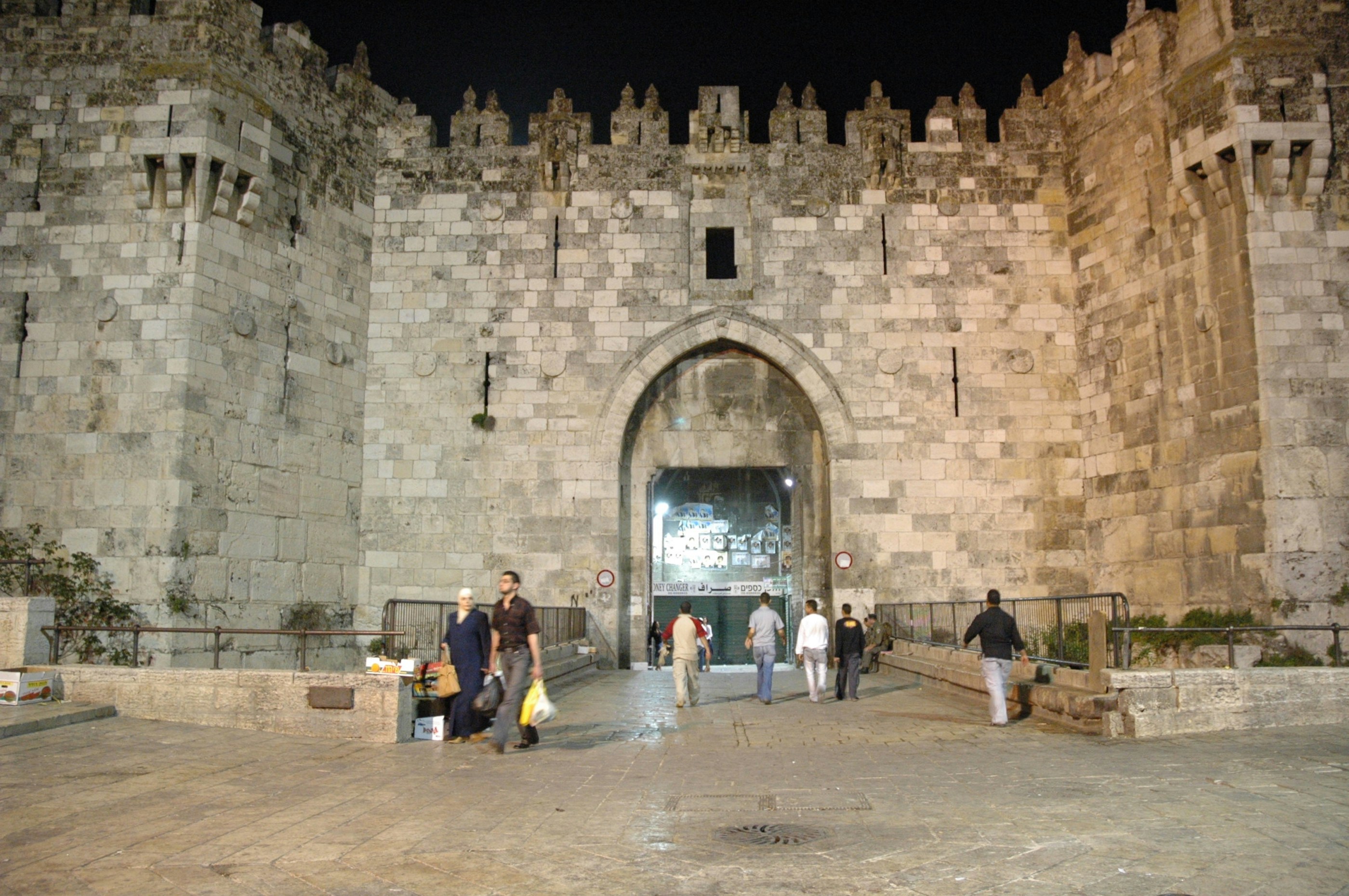 a group of people standing in front of a castle
