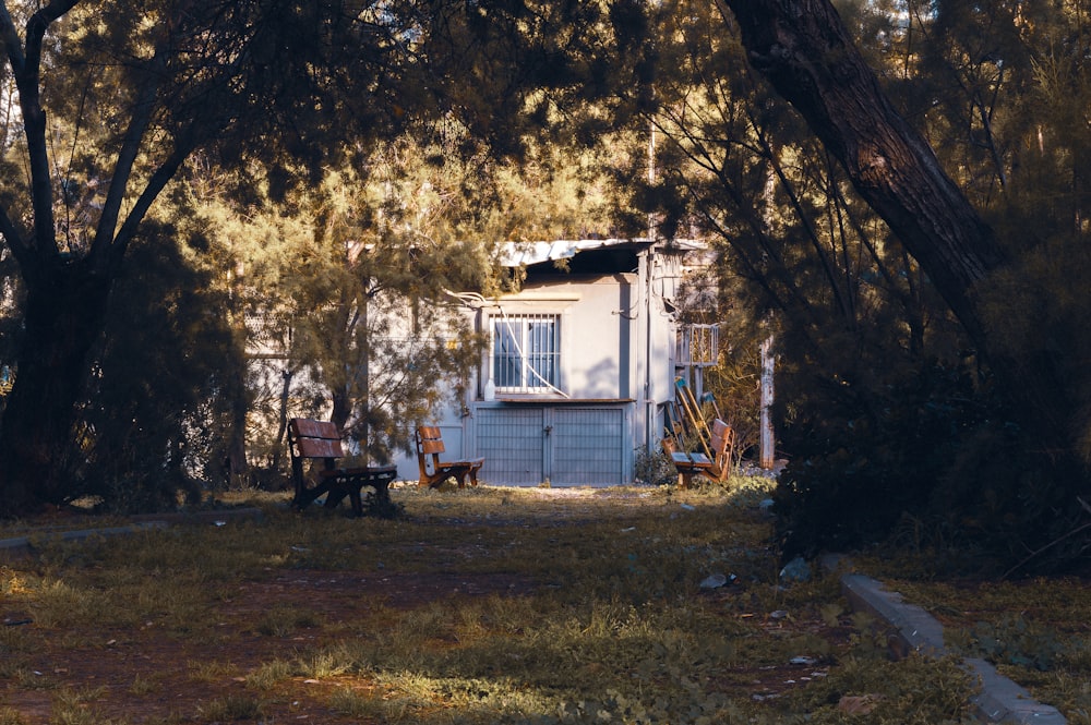 a couple of chairs sitting in front of a house