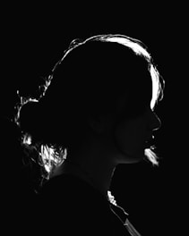 a black and white photo of a woman's profile