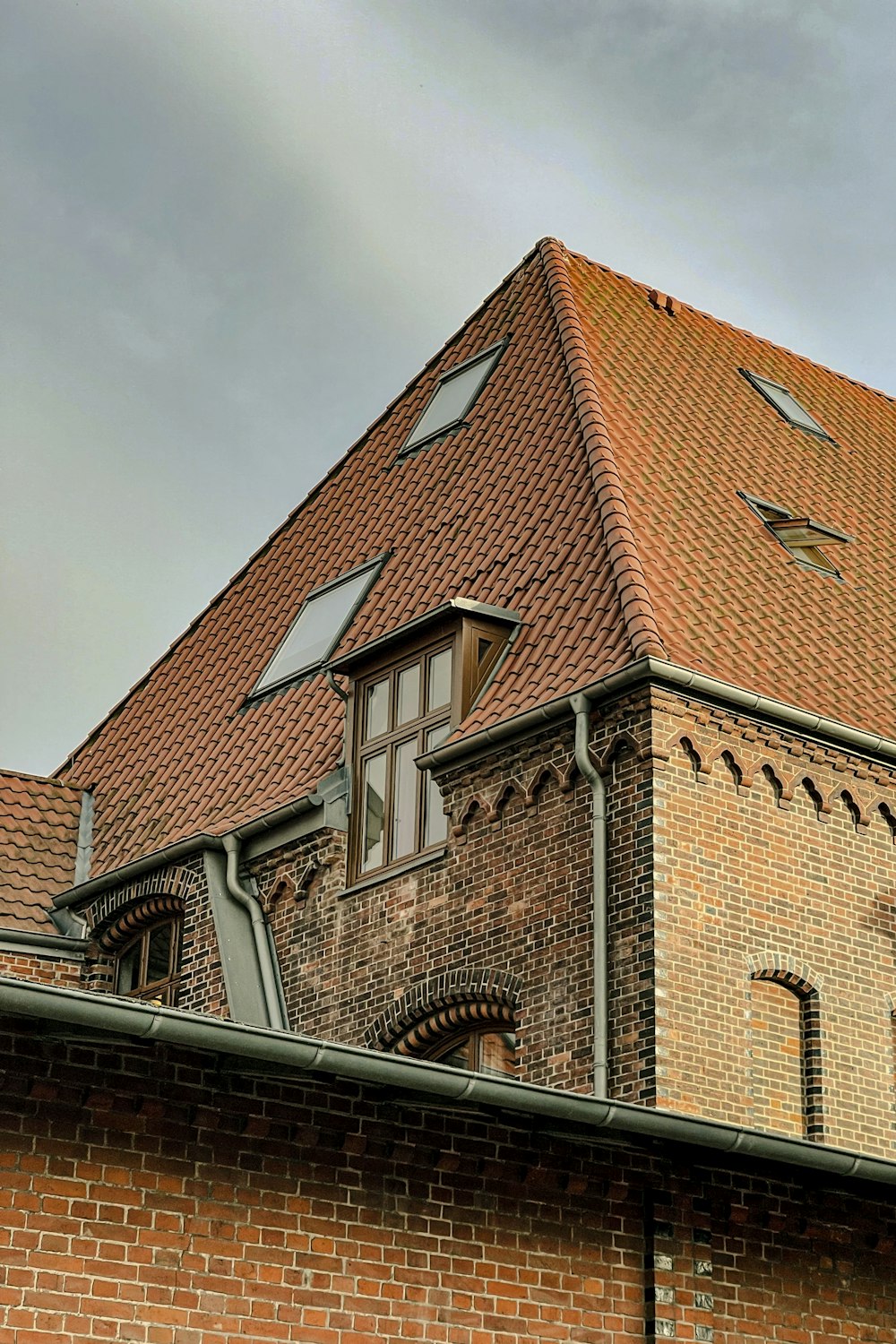 a brick building with a clock on the front of it