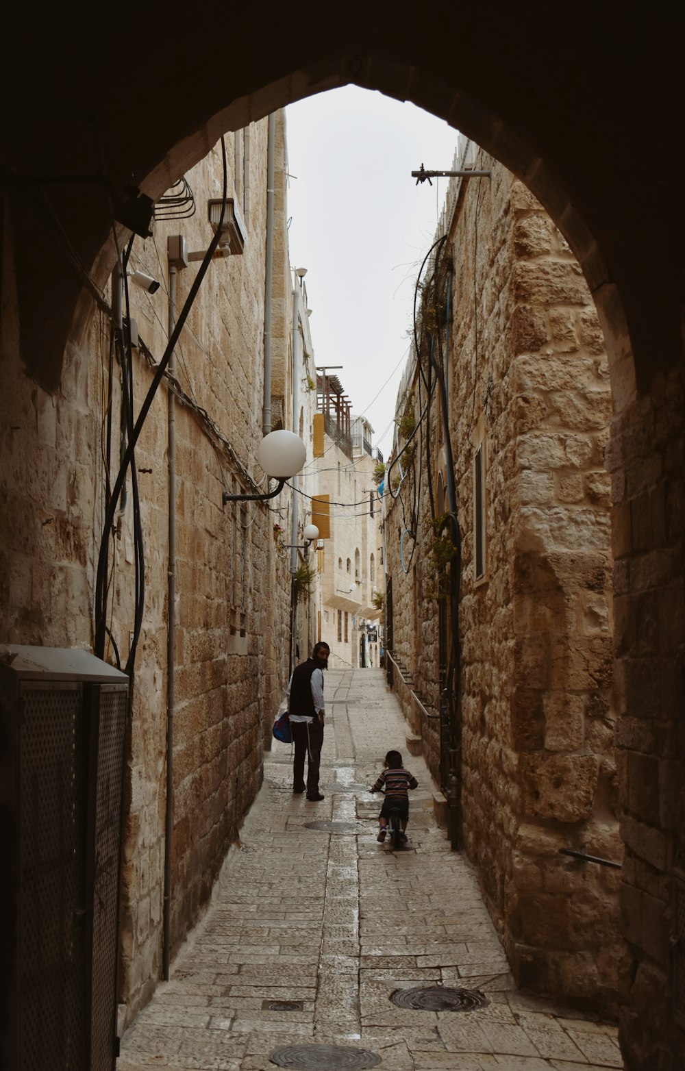 a couple of people that are walking down a street