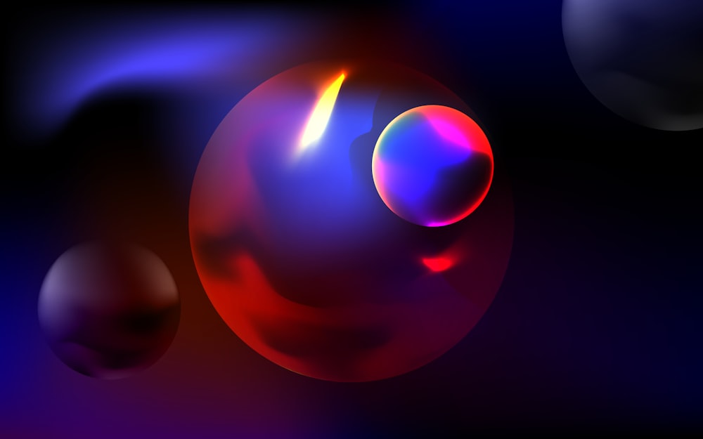a group of balls with different colors on a black background