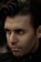 a close up of a person wearing a black shirt