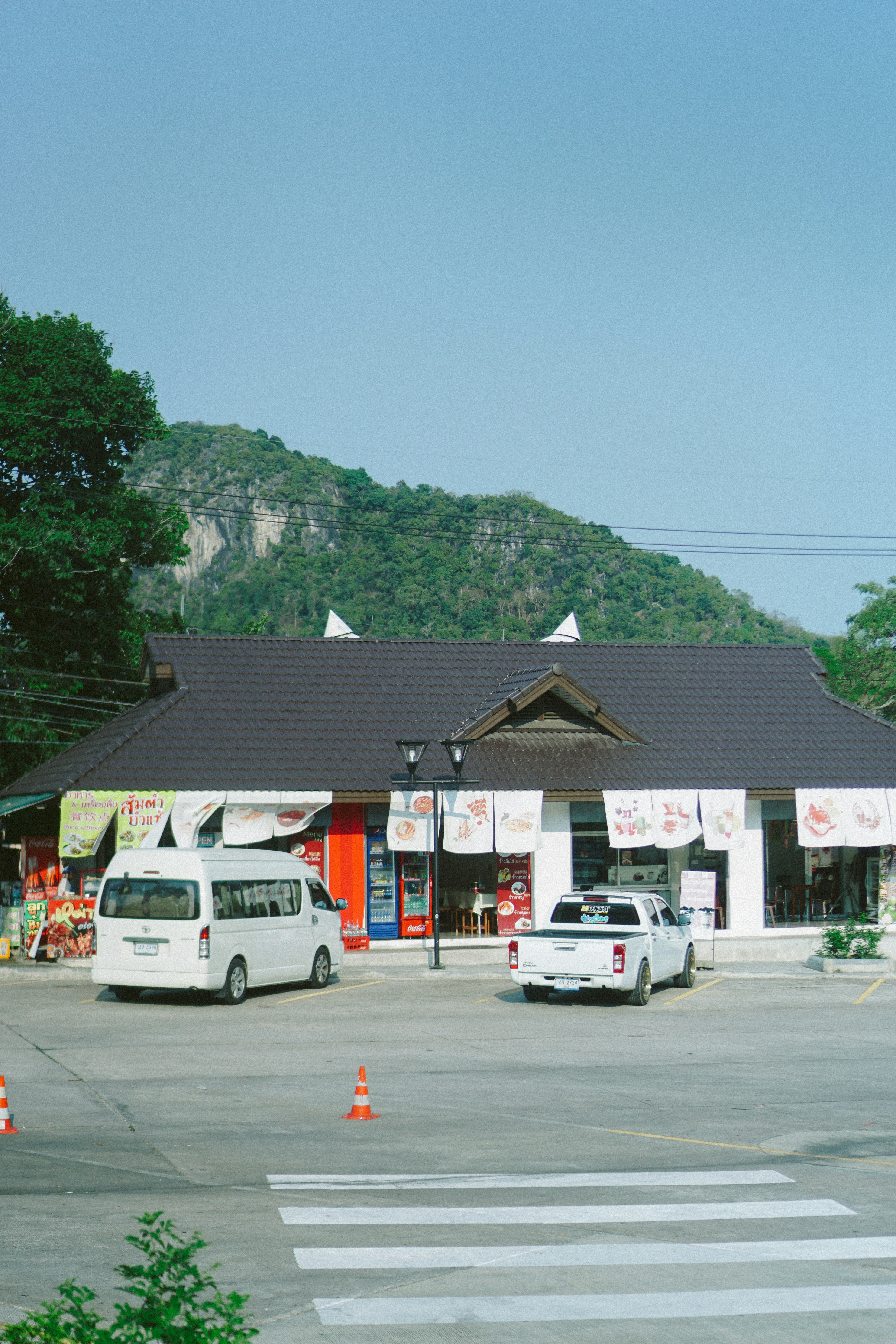 a white van parked in front of a building