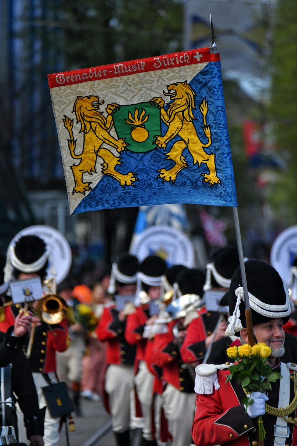 a group of men in uniform marching down a street