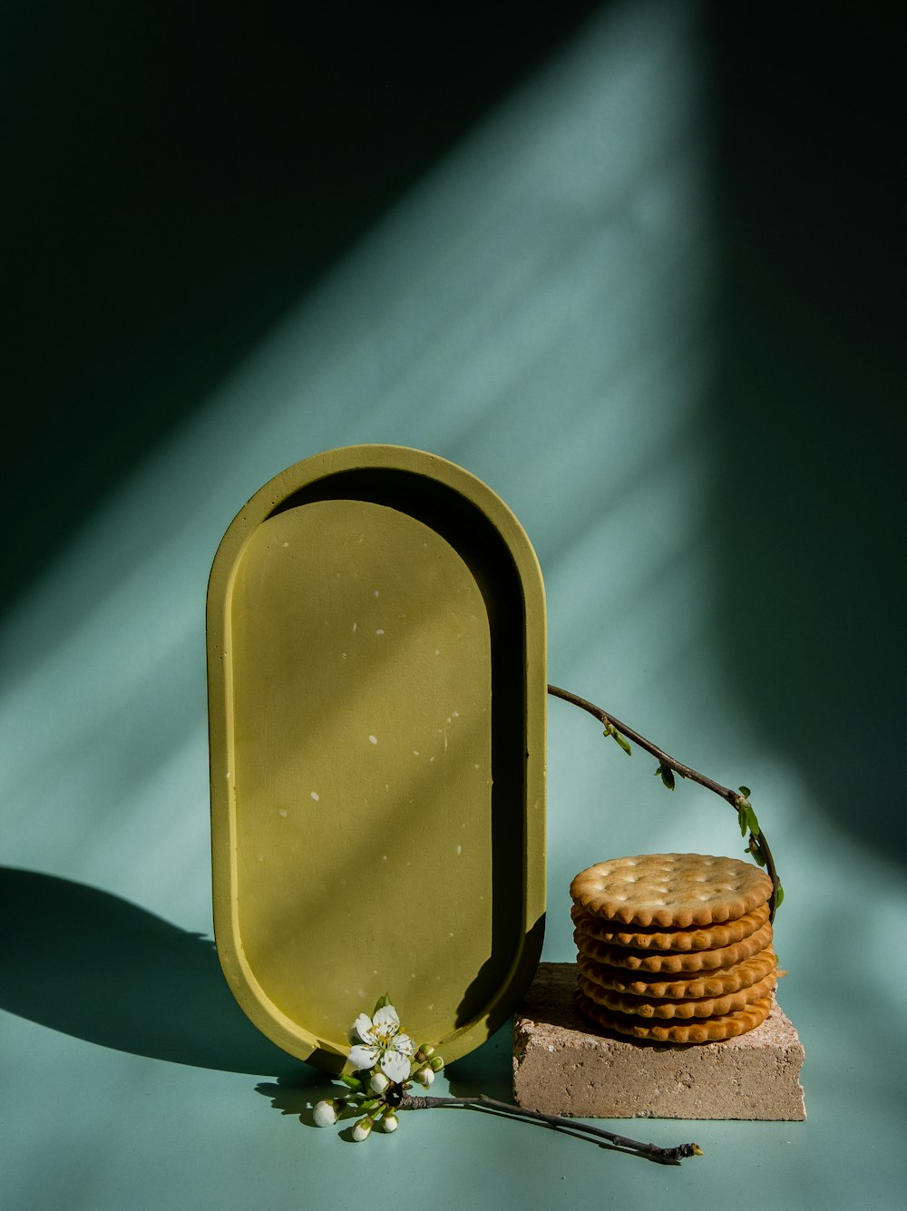 a stack of cookies sitting next to a yellow container