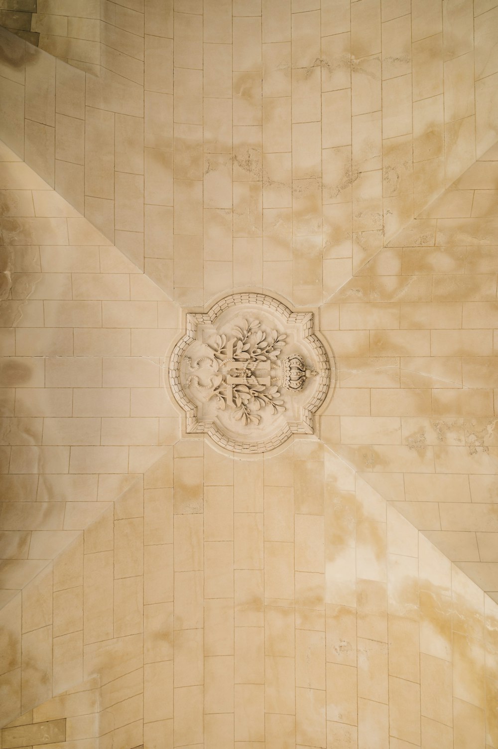 the ceiling of a building with a clock on it