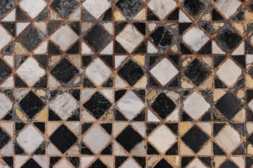 a black and white marble tile with a diamond pattern