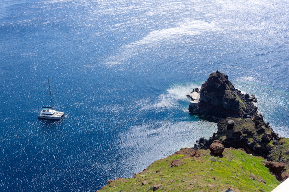 a small boat in the middle of a body of water