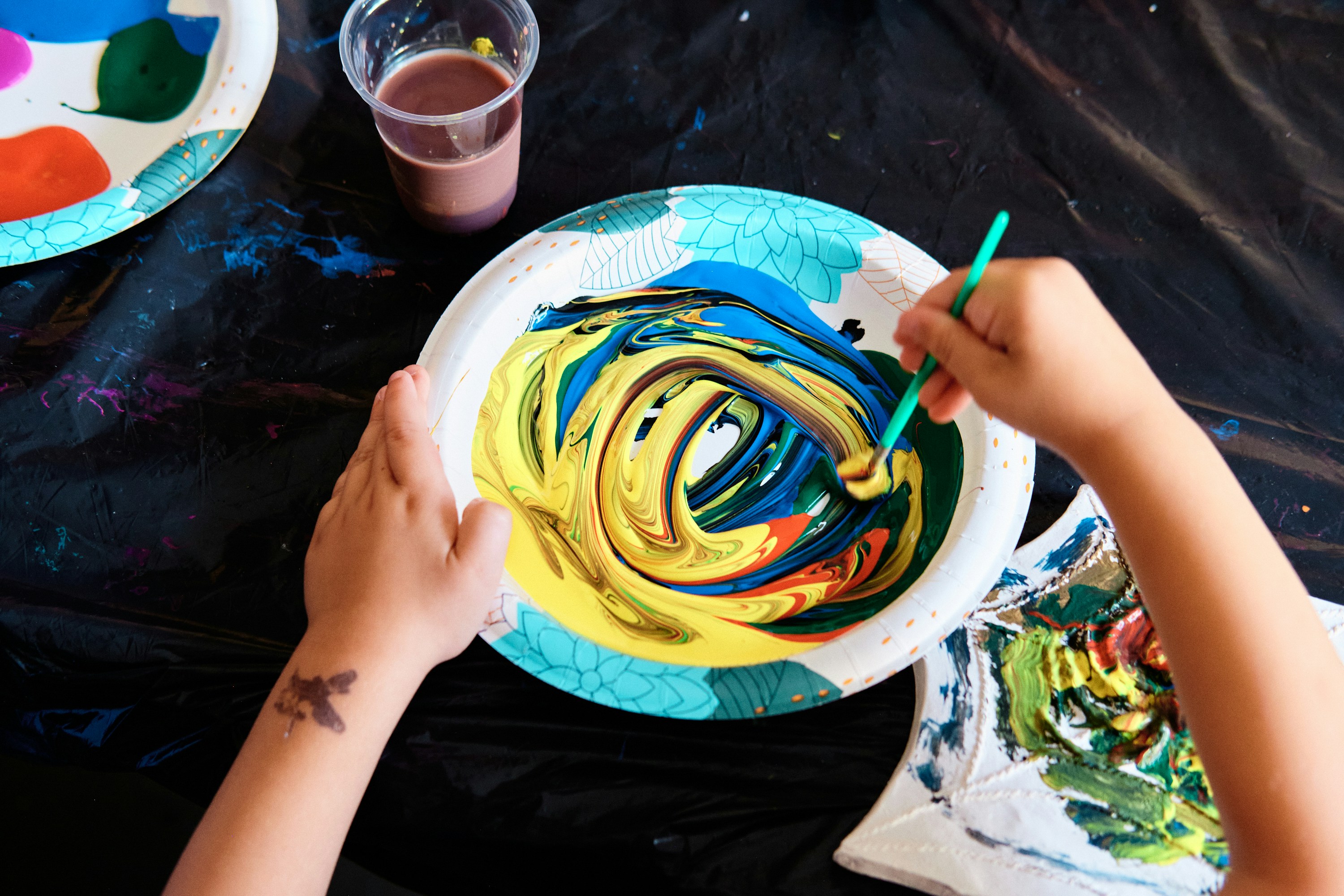 New Jersey, USA - April 21, 2023: Fun Crazy Paint Swirling Activity at Summer Camp