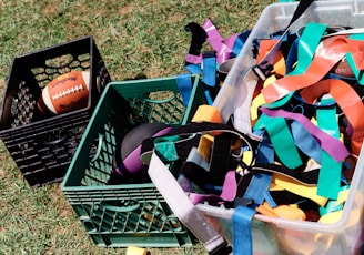 a basket full of colorful streamers and a football