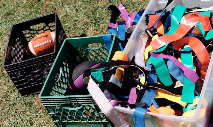 a basket full of colorful streamers and a football