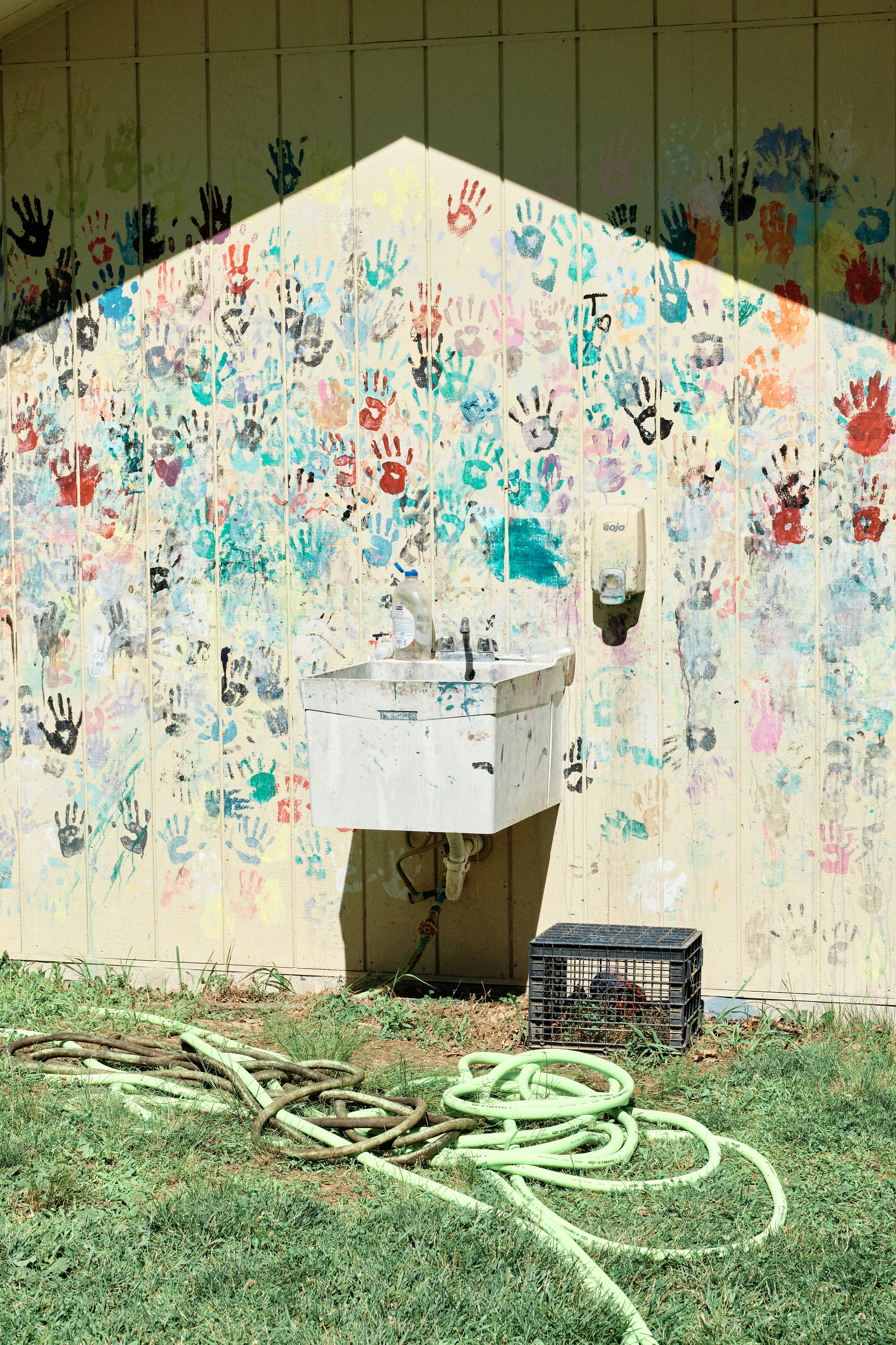 a bunch of graffiti on the side of a building