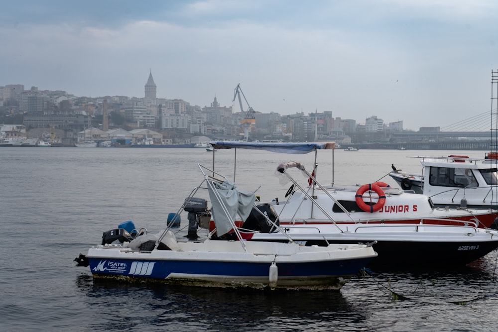 a couple of boats that are sitting in the water