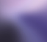 a blurry image of a purple and white background