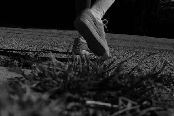 A close-up of running shoes on a track, emphasizing motion and speed.