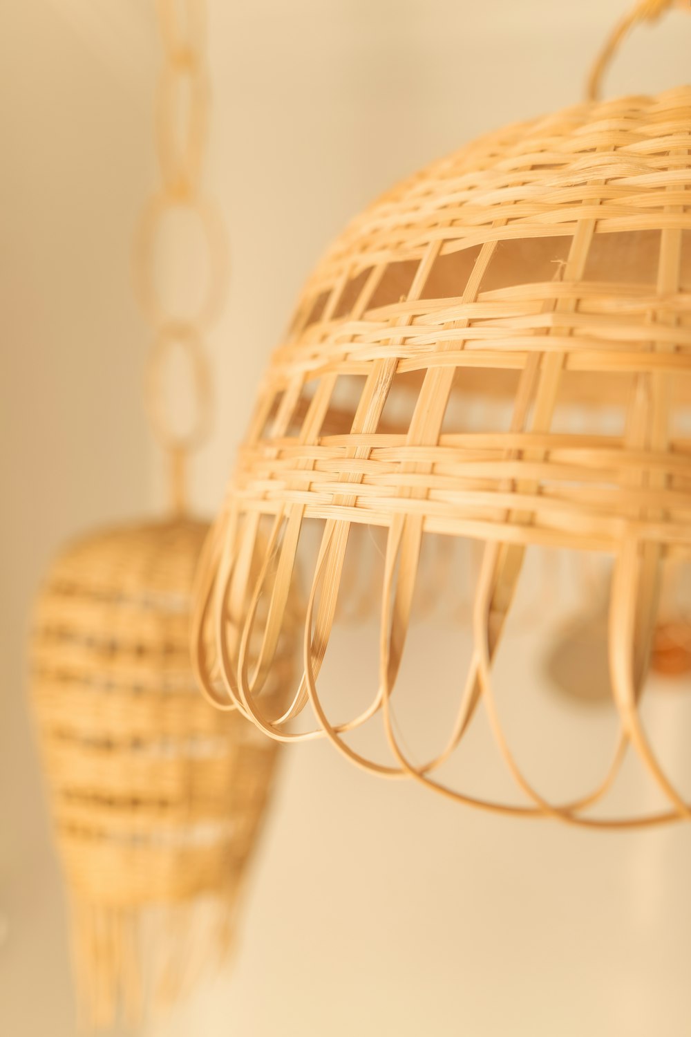 a close up of a light fixture made out of wicker