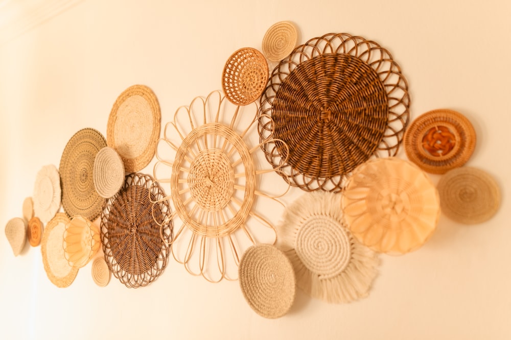 a group of woven baskets hanging on a wall