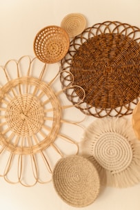 Woven rattan wall decor pieces creating a natural focal point on a neutral wall.